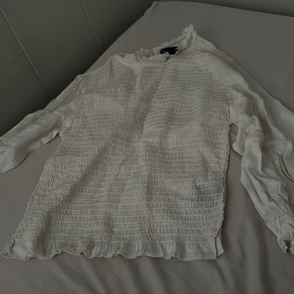 White blouse with flared arms